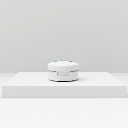 NUYU white pill cutter device on minimalist surface, wellness supplement UK accessory